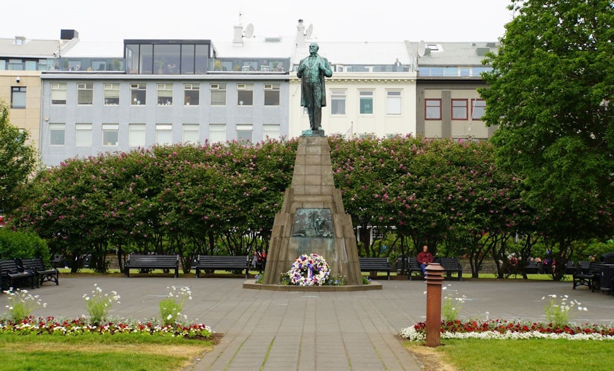 Statue of Jon Sigurdsson in front of Althingi in Reykjavik with flowers