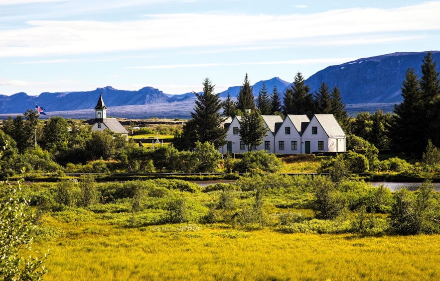Houses and church at Thingvellir national park in Iceland on a sunny summer day