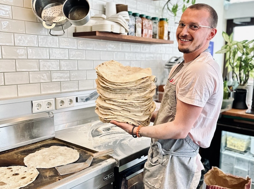 Chef at Chickpea restaurant in Reykjavik preparing home made wraps or bread