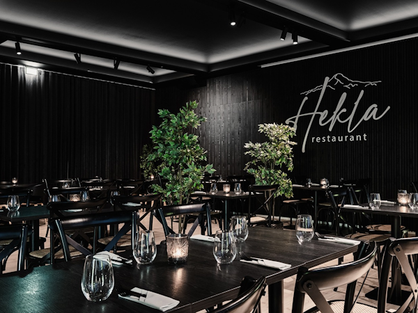 The elegant and contemporary ambiance of Hekla Restaurant, a dining haven offering a delightful culinary experience at Hótel Ísl