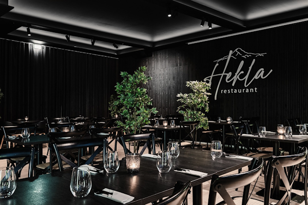 The elegant and contemporary ambiance of Hekla Restaurant, a dining haven offering a delightful culinary experience at Hótel Ísl