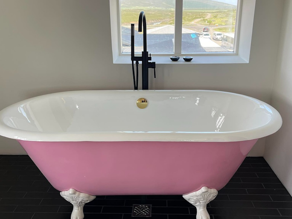 A pink bathtub in a suite at Hotel Godafoss in North Iceland.