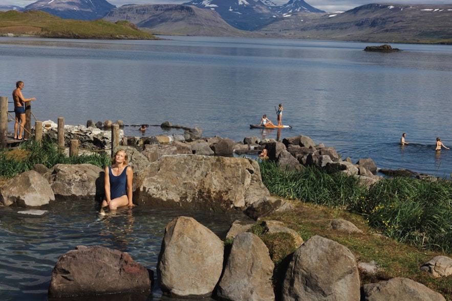 People enjoying activities during June at the Hvammsvik Hot Springs in Iceland