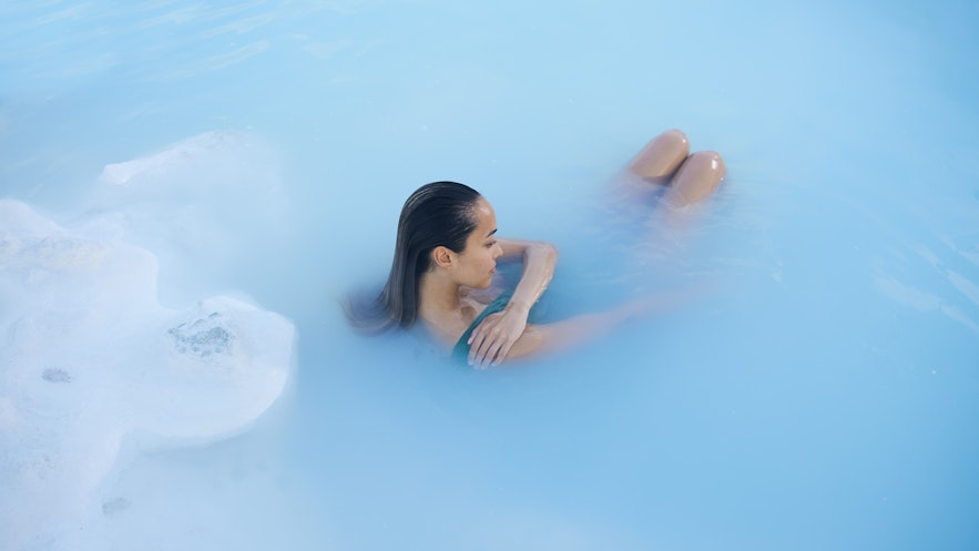 Woman relaxing at the Blue Lagoon in Iceland