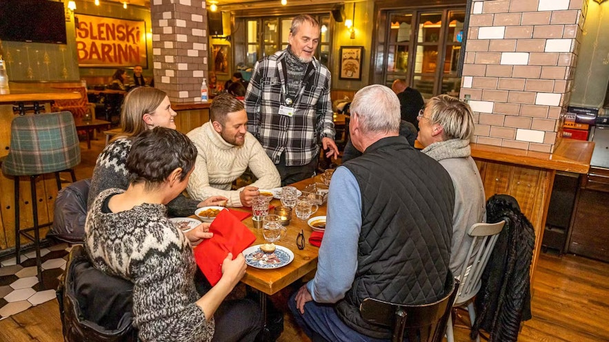 People can enjoy each others company during a Reykjavik food walk tour, a great time to try out the Icelandic skills you learned from the Drops app
