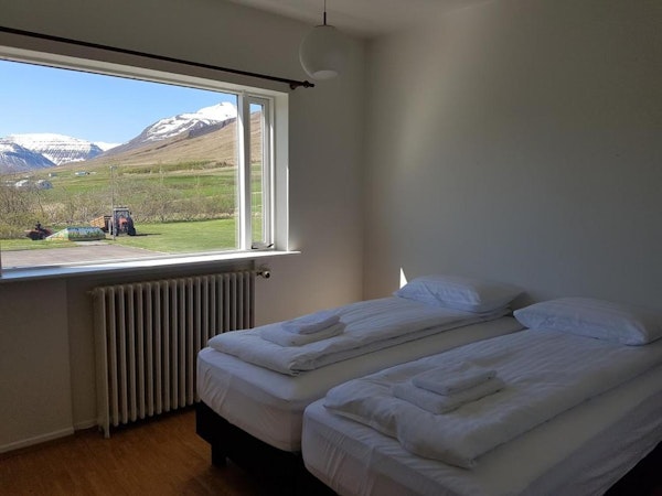 A double room with gorgeous views of nature at Husabakki Guesthouse in North Iceland.