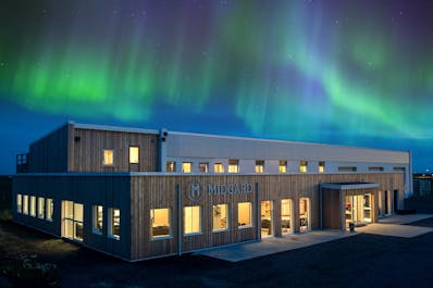 The northern lights appear in the sky above Midgard Base Camp in South Iceland.