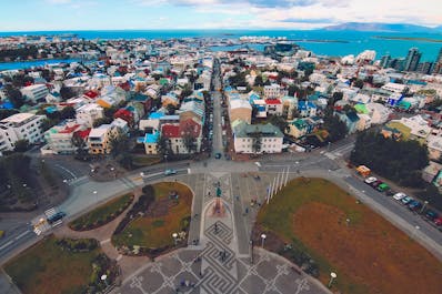 Reykjavik features colorful houses surrounded by a beautiful bay.