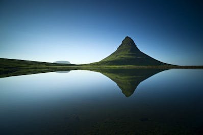 Kirkjufell mountain has a distinct peak and shape.