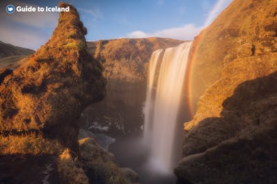 Rainbows are common sights around the Skogafoss waterfall on a sunny day.