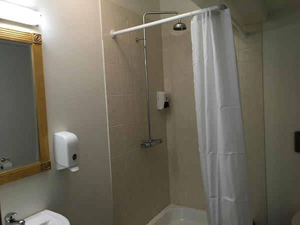 Recharge your senses with an invigorating shower in the well-appointed bathroom, designed for your ultimate comfort.