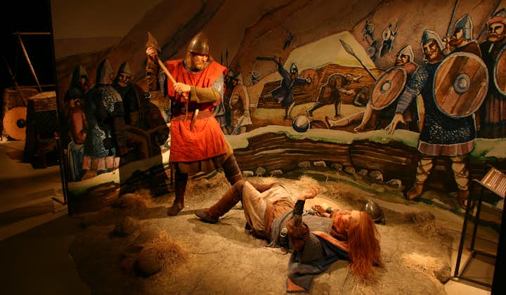 A wax model of a Viking standing over another Viking with an axe at the Saga Museum in Reykjavik.