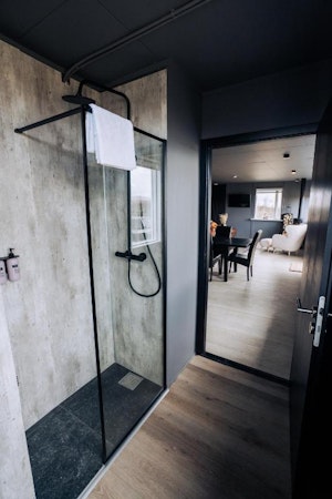 Showers are fixtures in the bathrooms of the Golden Circle Luxury Cottages.