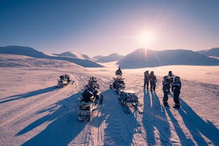 Zoom across the pristine snowscape atop Eyjafjallajokull on an exhilarating snowmobiling adventure.
