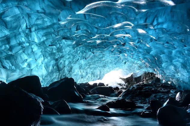An ice cave in Iceland featuring translucent ice ceiling and walls.