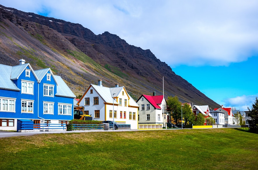 Isafjordur has charming old buildings nestled in a stunning natural backdrop.