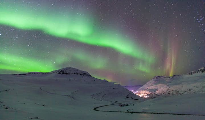 The northern lights look more breathtaking with a snowy landscape setting in East Iceland.