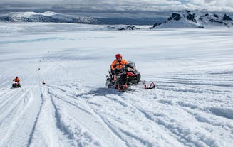 A snowmobile rider zooms over an ice cap in Iceland.