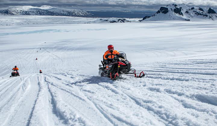 A snowmobile rider zooms over an ice cap in Iceland.