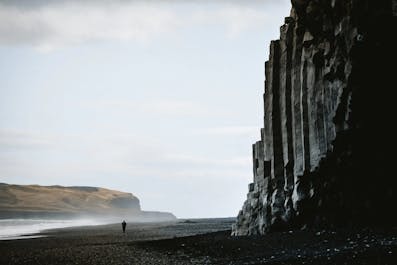 Black sand beauty at Reynisfjara Beach, where the roaring waves meet dramatic basalt columns.