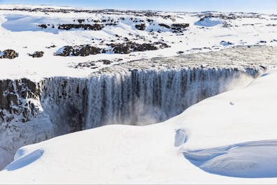 Winter's icy grip transforms Dettifoss into a frozen masterpiece.