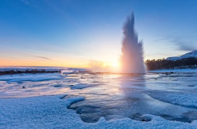 Strokkur geyser in action, a mesmerizing display of Iceland's fiery geothermal power.