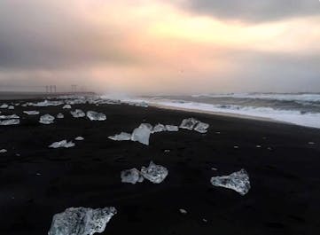 Sparkling ice gems adorning Diamond Beach, where glacial icebergs find their way to the black sands.