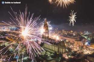 A breathtaking display of fireworks lights up the Reykjavik skyline.