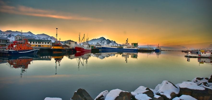 The picturesque harbor in the fishing village of Hofn in Southeast Iceland, seen at sunset.