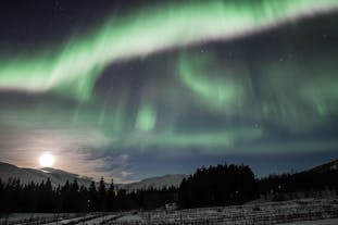 The aurora borealis lights up the winter sky near Akureyri in splashes of color.