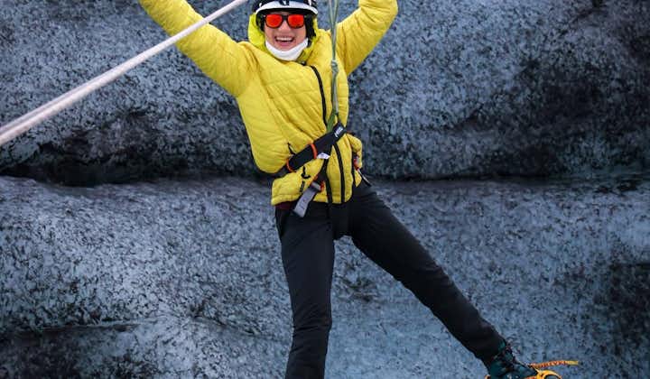 A person poses for a photo on a zip-line across a glacier in Southeast Iceland.