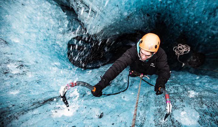 A person tries their hand at the exciting activity of ice climbing in Vatnajokull National Park.