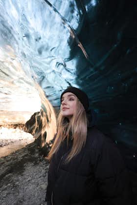 A photograph of a person in an ice cave.
