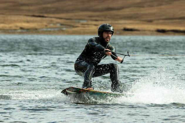 A traveler enjoying a wakeboarding experience in the Westfjords.