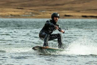 A traveler enjoying a wakeboarding experience in the Westfjords.