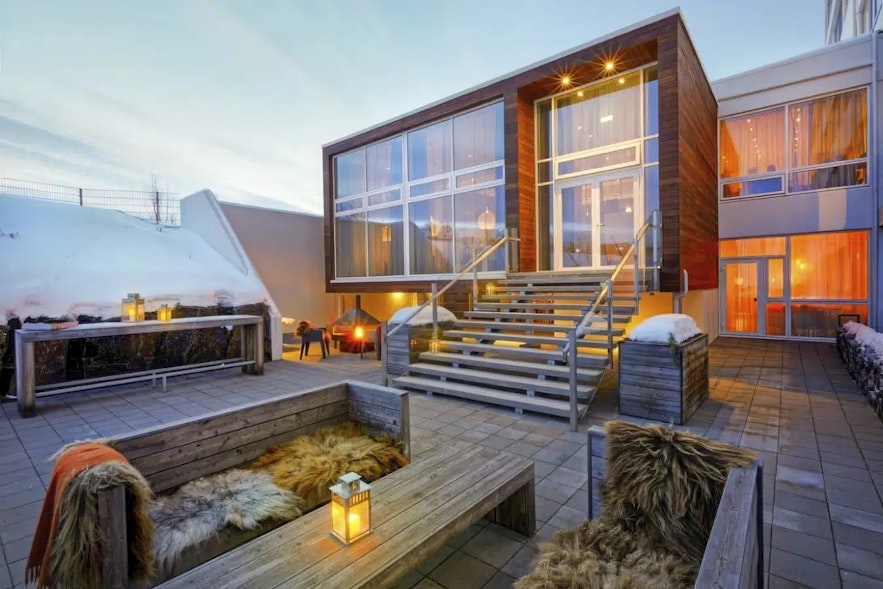 The Berjaya Hotel in Akureyri as a cozy outdoor patio with a firepit