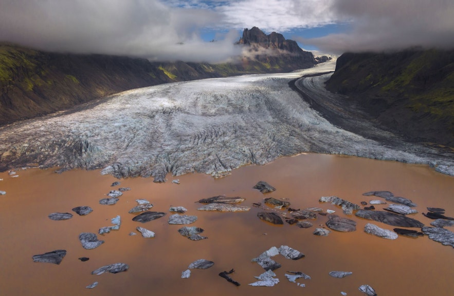 Explore dramatic glacier tongues and ice bergs in Iceland