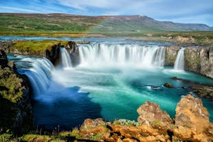At Godafoss, witness the sheer force and timeless elegance of this Icelandic waterfall.