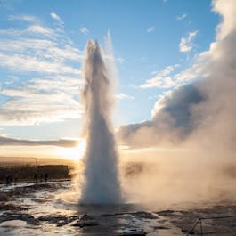 The Strokkur geyser erupts with great force.