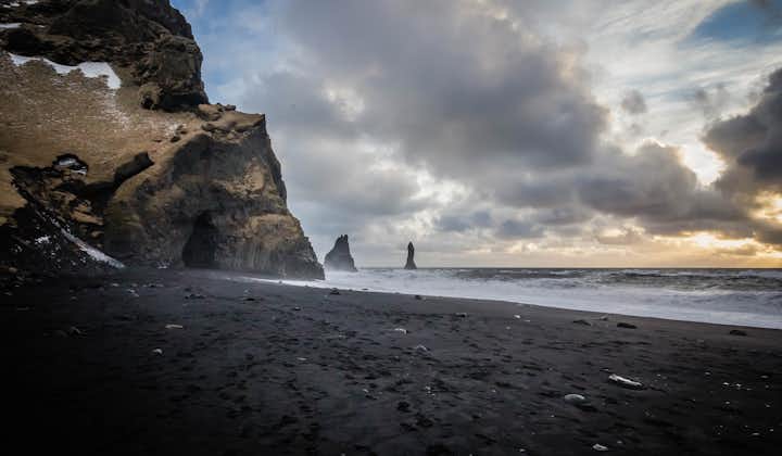 Reynisfjara beach looks magnificent with its volcanic black sands.
