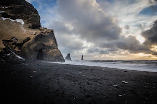 Reynisfjara beach looks magnificent with its volcanic black sands.
