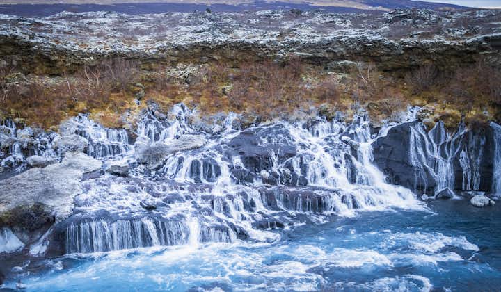 Discover the wonders of Hraunfossar, where beauty unfolds as streams gracefully flow over dark lava, a hidden gem in West Iceland.