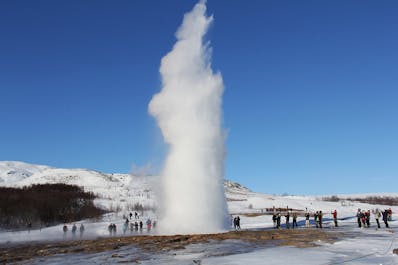 Strokkur geyser shooting a column of steam into the Icelandic air.
