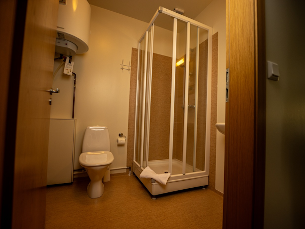 A modern and pristine bathroom at Fljotsdalsgrund, ensuring comfort and relaxation during your stay.