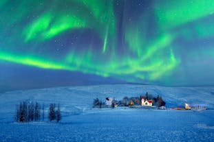 The northern lights swirl over Hvolsvollur, a town in South Iceland.