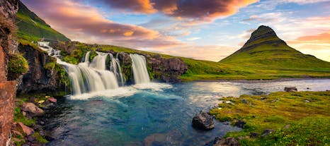 Kirkjufell and Kirkjufellsfoss are a mountain and waterfall on the Snaefellsnes Peninsula.