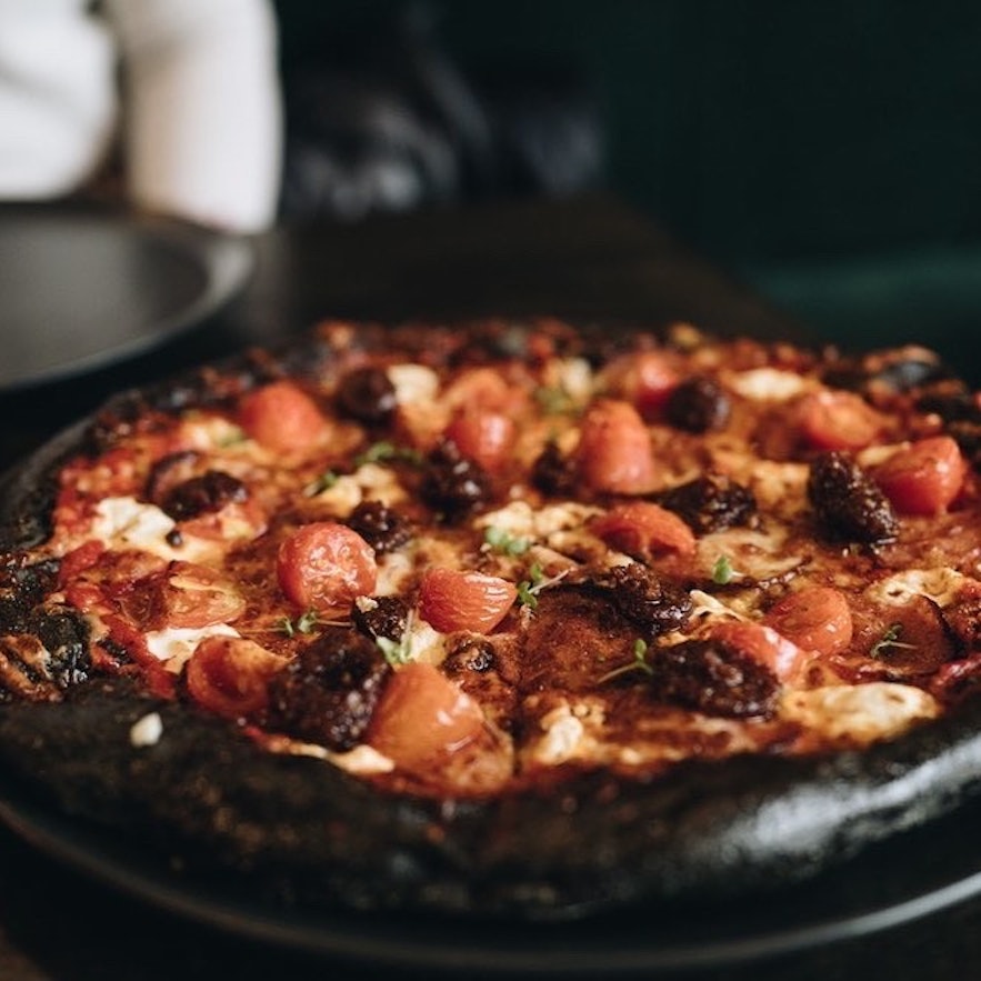 The crust of Black Crust Pizzaria is, unsurprisingly, very dark