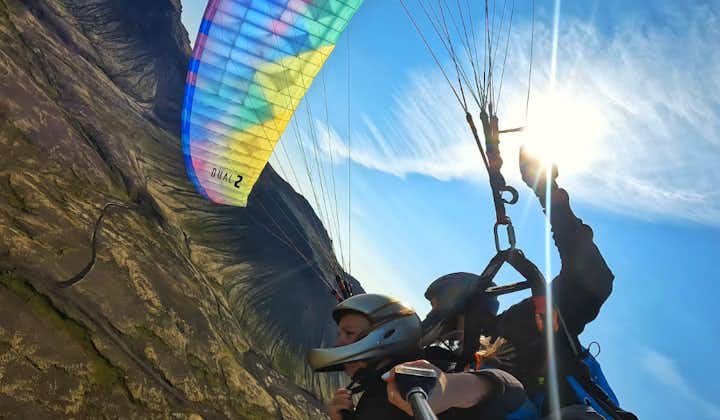 Paraglide gracefully over vast lava fields, offering a unique and thrilling perspective of Iceland's rugged terrain.