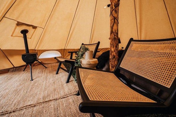Close up of two chairs inside a glamping tent at the Golden Circle Tents Glamping Experience.