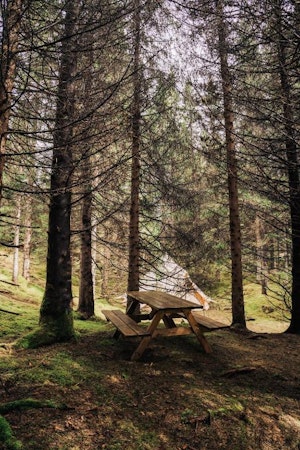 A picnic bench at the Golden Circle Tents Glamping Experience.